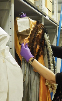 Clare examining the costume collection store