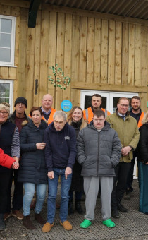 Residents of Jacks Place stand with Harriett Baldwin and Marc Bayliss