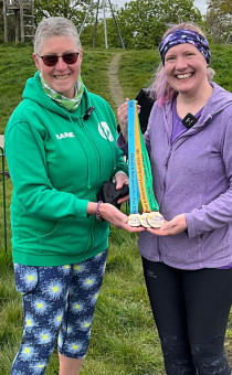 Marie and Abi pose wih Wythall Fun Run medals