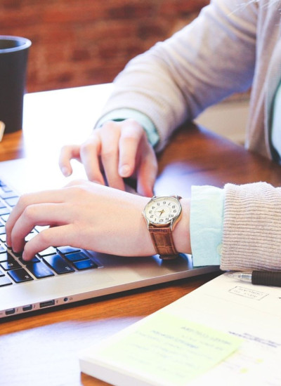 Person typing on laptop