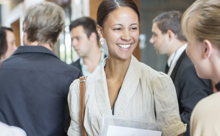 A woman in conversation with a group